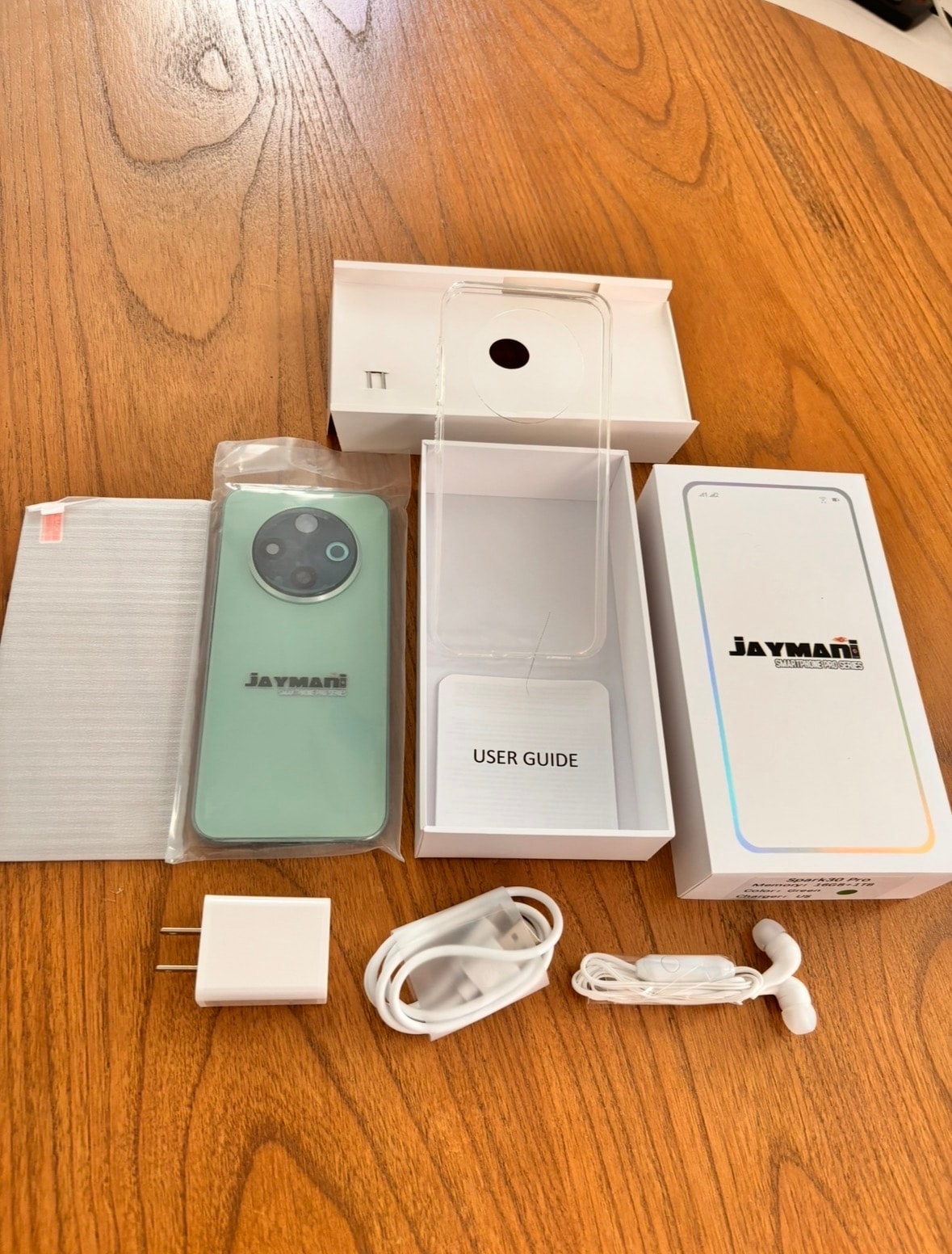 Jaymani Smartphone Pro unboxing — phone, case, charger, cable, earbuds, screen protector, user guide